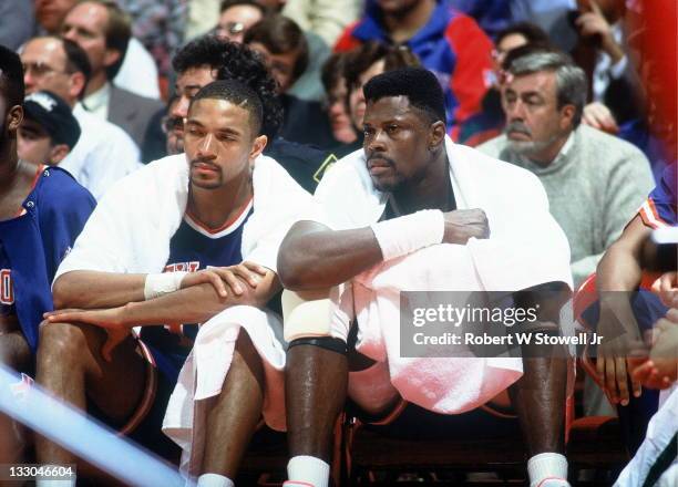 New York Knicks point guard Mark Jackson and center Patrick Ewing sit together on the bench during a game against the Boston Celtics, Hartford, CT,...