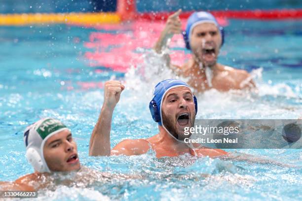 Konstantinos Genidounias of Team Greece celebrates a goal, taking the score to 6-6, during the Men's Preliminary Round Group A match between Hungary...