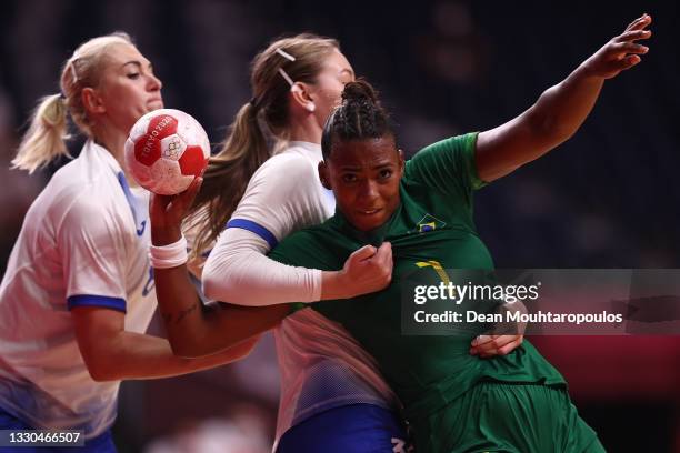 Tamires de Araujo of Team Brazil is challenged by Antonina Skorobogatchenko and Anna Sen of Team ROC during the Women's Preliminary Round Group B...
