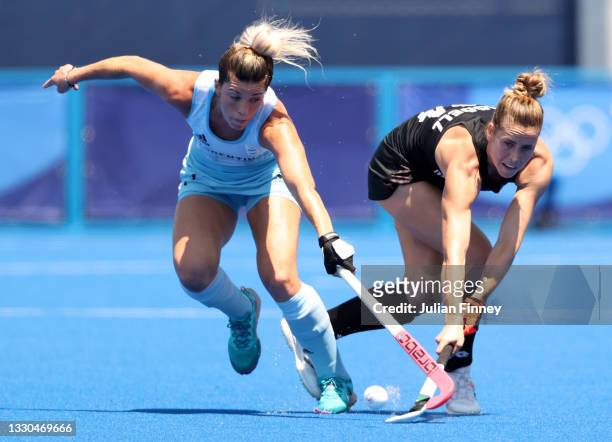 Rose Keddell of Team New Zealand and Agustina Albertarrio of Team Argentina battle for a loose ball during the Women's Pool B match on day two of the...