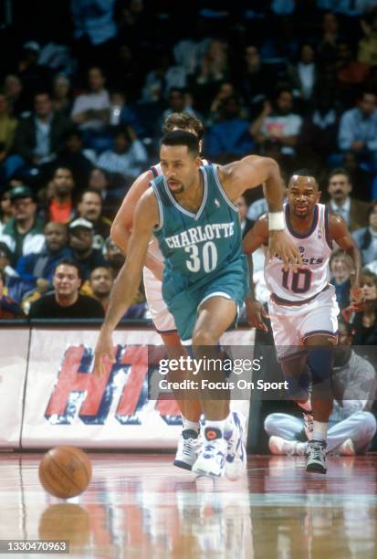 Dell Curry of the Charlotte Hornets dribbles the ball against the Washington Bullets during an NBA basketball game circa 1993 at the US Airways Arena...