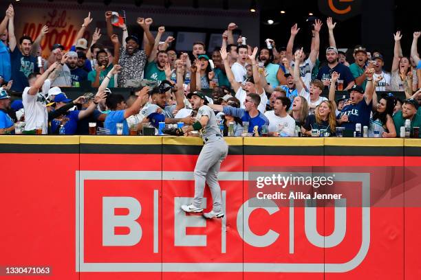 Ramon Laureano of the Oakland Athletics reacts after missing a Seattle Mariners home run in the third inning of the game at T-Mobile Park on July 24,...