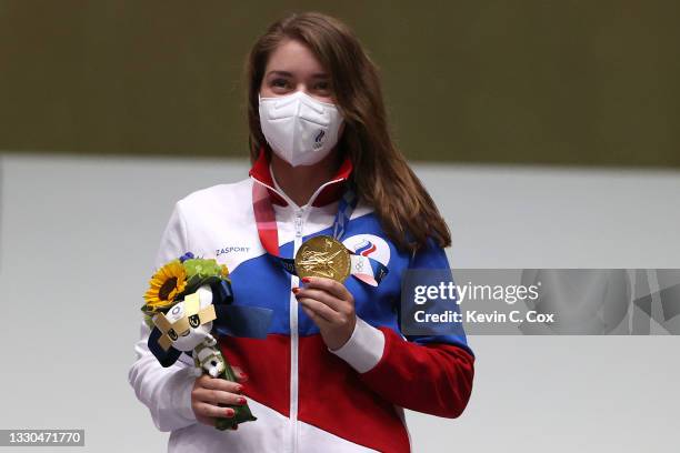 Gold Medalist and Olympic Record holder Vitalina Batsarashkina of Team ROC poses during the medal ceremony of the 10m Air Pistol Women's event on day...