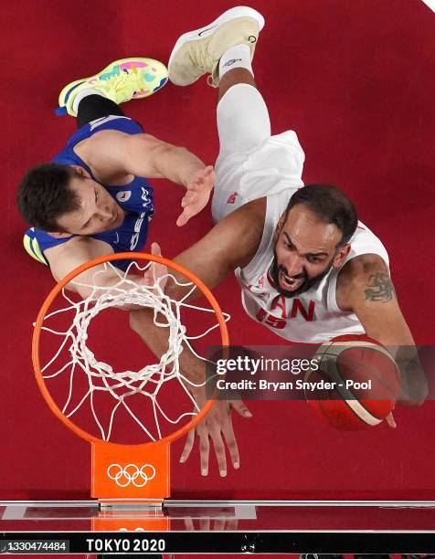 Hamed Haddadi of Team Iran goes up for a shot against Jaromir Bohacik of Team Czech Republic during the second half on day two of the Tokyo 2020...