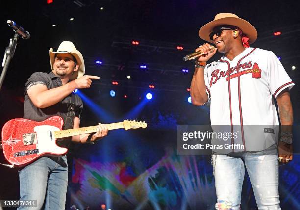 Brad Paisley and Jimmie Allen perform onstage during Brad Paisley's tour at Ameris Bank Amphitheatre on July 24, 2021 in Alpharetta, Georgia.