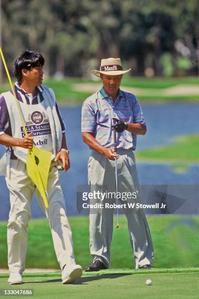 Isao Aoki reads a putt during the PGA Senior Championship, Florida, 1996.