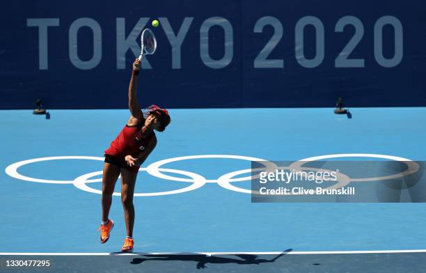 Naomi Osaka of Team Japan serves during her Women's Singles First Round match against Saisai Zheng of Team China on day two of the Tokyo 2020 Olympic...