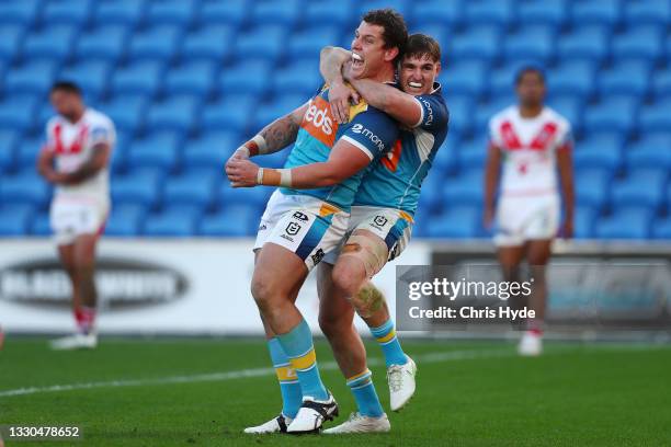 Jarrod Wallace of the Titans celebrates a try during the round 19 NRL match between the St George Illawarra Dragons and the Gold Coast Titans at Cbus...