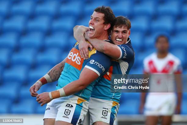 Jarrod Wallace of the Titans celebrates a try during the round 19 NRL match between the St George Illawarra Dragons and the Gold Coast Titans at Cbus...