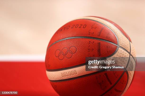 The officail Tokyo 2020 Olympic basketball sits on the court during the first half on day two of the Tokyo 2020 Olympic Games between Italy and...