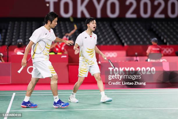 Endo Hiroyuki and Watanabe Yuta of Team Japan react as they compete against Vladimir Ivanov and Ivan Sozonov of Team ROC during a Men's Doubles Group...