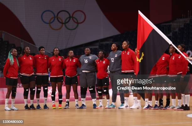 Team Angola are seen standing for their national anthem ahead of the Women's Preliminary Round Group A match between Montenegro and Angola on day two...