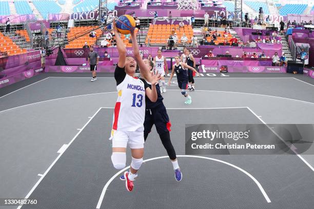 Khulan Onolbaatar of Team Mongolia drives to the basket during the Women's Pool Round match between Mongolia and ROC on day two of the Tokyo 2020...
