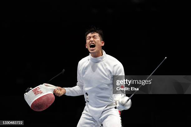 Kazuyasu Minobe of Team Japan celebrates after his win against Jakub Jurka of Team Czech Republic in Men's Individual Épée second round on day two of...