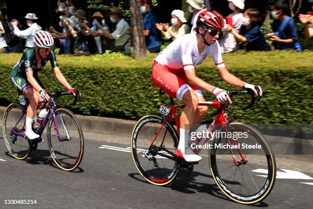 Carla Oberholzer of Team South Africa & Anna Plichta of Team Poland in the breakaway during the Women's road race on day two of the Tokyo 2020...