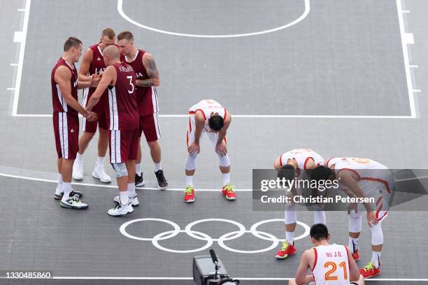 Team Latvia celebrate victory after defeating Team China during the Men's Pool Round match between China and Latvia on day two of the Tokyo 2020...