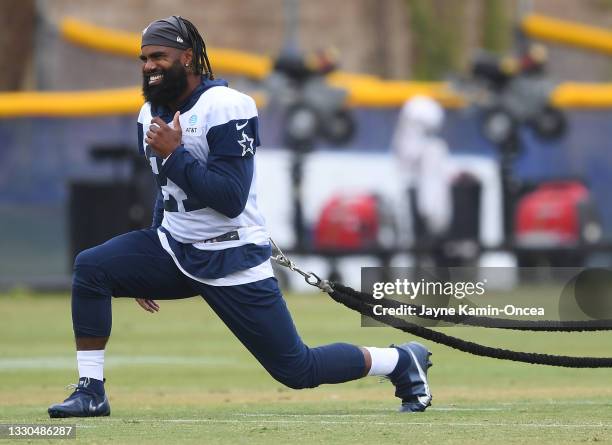 Running back Ezekiel Elliott of the Dallas Cowboys warms up before the start of training camp at River Ridge Complex on July 24, 2021 in Oxnard,...