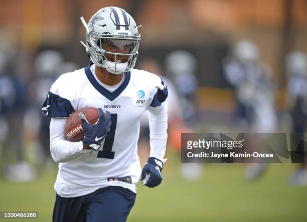 Wide receiver Cedrick Wilson of the Dallas Cowboys runs the ball during training camp at River Ridge Complex on July 24, 2021 in Oxnard, California.