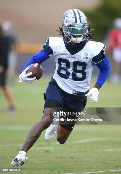 Wide receiver CeeDee Lamb of the Dallas Cowboys runs the ball during training camp at River Ridge Complex on July 24, 2021 in Oxnard, California.