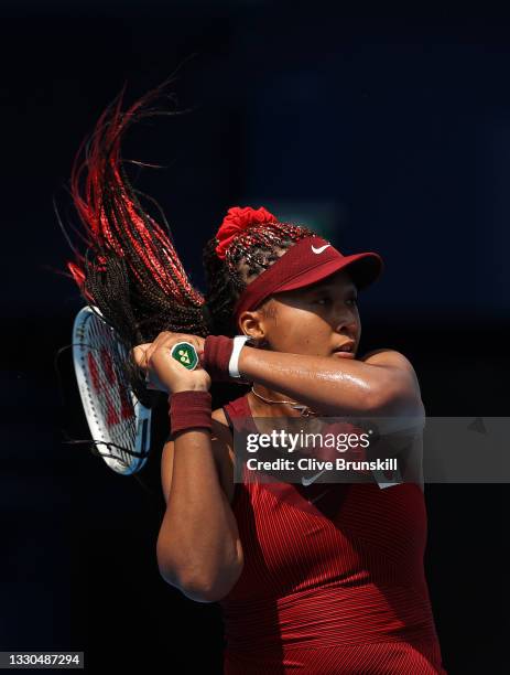 Naomi Osaka of Team Japan plays a backhand during her Women's Singles First Round match against Saisai Zheng of Team China on day two of the Tokyo...