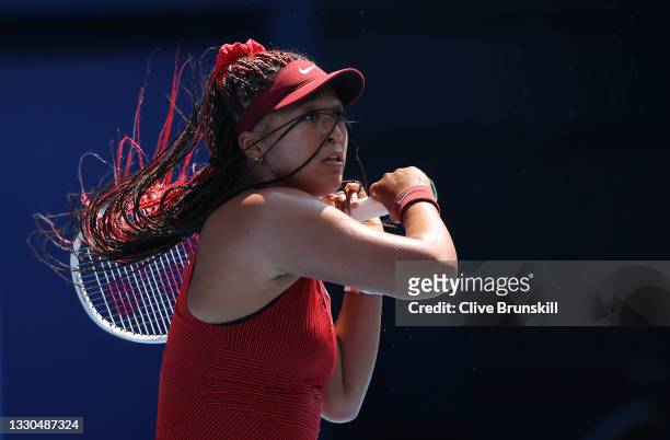 Naomi Osaka of Team Japan plays a forehand during her Women's Singles First Round match against Saisai Zheng of Team China on day two of the Tokyo...