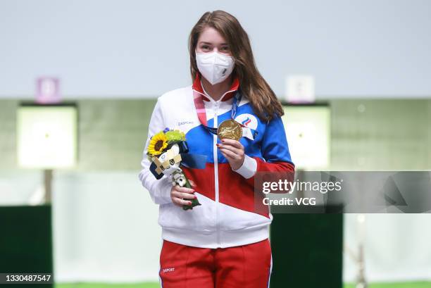 Gold medalist Vitalina Batsarashkina of Russia celebrates on the podium after the 10m Air Pistol Women's Final on day two of the Tokyo 2020 Olympic...