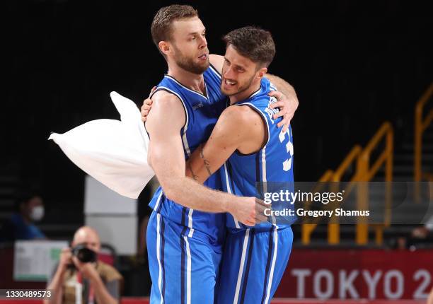 Nicolo Melli of Team Italy and Achille Polonara of Team Italy celebrate a win against Germany on day two of the Tokyo 2020 Olympic Games at Saitama...