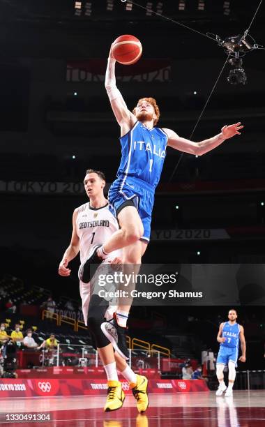 Niccolo Mannion of Team Italy goes up for a shot against Joshiko Saibou of Team Germany during the second half on day two of the Tokyo 2020 Olympic...