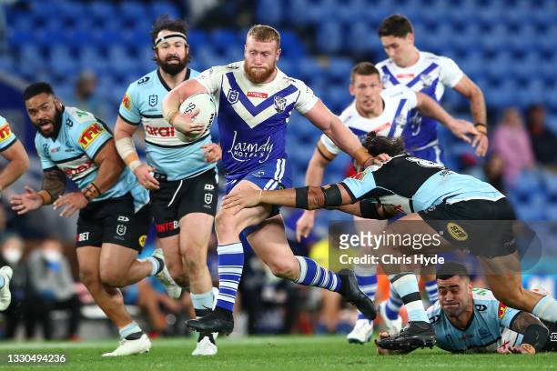 Luke Thompson of the Bulldogs makes a break during the round 19 NRL match between the Canterbury Bulldogs and the Cronulla Sharks at Cbus Super...