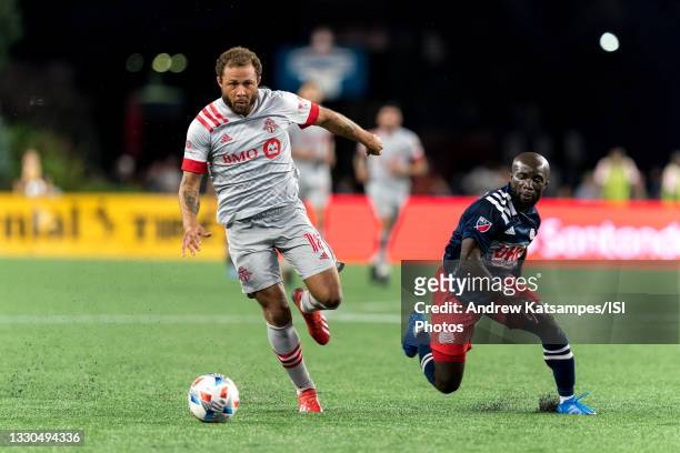 Nick DeLeon of Toronto FC brings the ball forward during a game between Toronto FC and New England Revolution at Gillette Stadium on July 7, 2021 in...