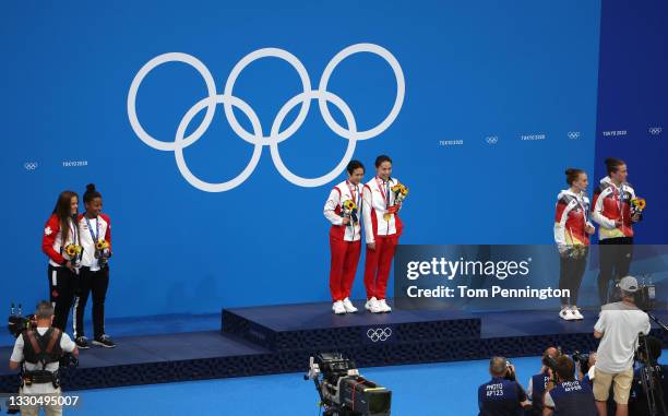 Silver medalists Jennifer Abel and Melissa Citrini Beaulieu of Team Canada, gold medalists Tingmao Shi and Han Wang of Team China, and bronze...