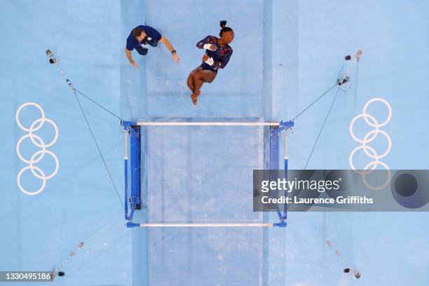 Simone Biles of Team United States competes on uneven bars during Women's Qualification on day two of the Tokyo 2020 Olympic Games at Ariake...
