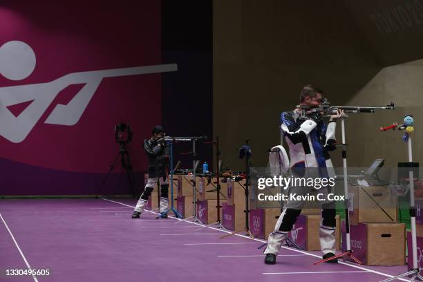 Lihao Sheng of Team China and William Shaner of Team United States during the finals of the 10m Air Rifle Men's event event on day two of the Tokyo...