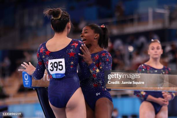 Sunisa Lee and Simone Biles of Team United States react during Women's Qualification on day two of the Tokyo 2020 Olympic Games at Ariake Gymnastics...