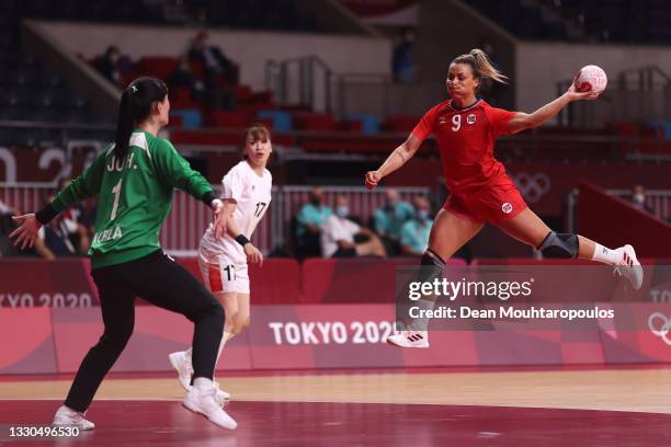 Nora Moerk of Team Norway shot on goal is blocked by Ju Hui of Team South Korea during the Women's Preliminary Round Group A match between Norway and...