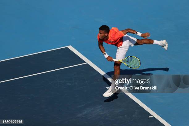 Felix Auger-Aliassime of Team Canada serves during his Men's Singles First Round match against Max Purcell of Australia on day two of the Tokyo 2020...