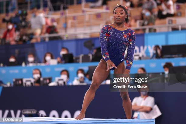 Simone Biles of Team United States reacts after falling off the mat on her dismount from balance beam during Women's Qualification on day two of the...