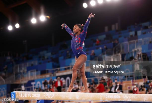Simone Biles of Team United States competes on balance beam during Women's Qualification on day two of the Tokyo 2020 Olympic Games at Ariake...