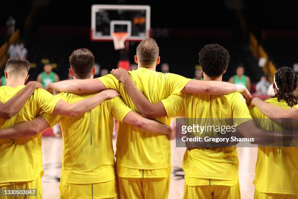 Members of Team Australia men's basketball team stand together during the anthem before their game against Nigeria on day two of the Tokyo 2020...