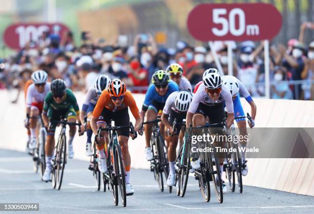 Marianne Vos of Team Netherlands sprints ahead of Lisa Brennauer of Team Germany on arrival during the Women's road race on day two of the Tokyo 2020...