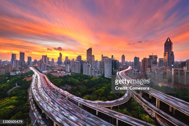 shanghai viaduct traffic at sunset, china - elevated road stock pictures, royalty-free photos & images