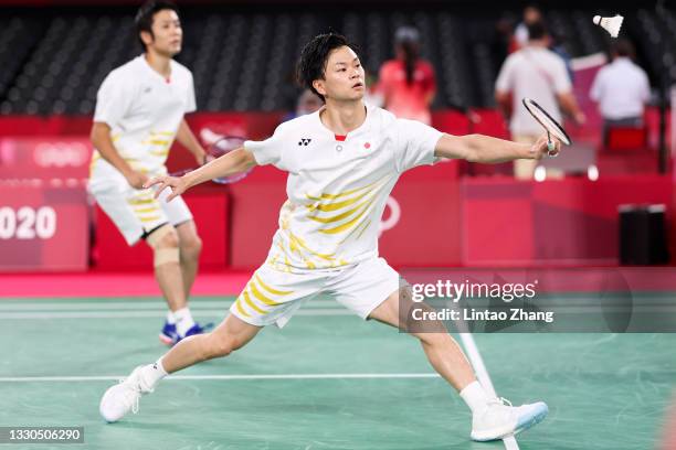 Endo Hiroyuki and Watanabe Yuta of Team Japan compete against Vladimir Ivanov and Ivan Sozonov of Team ROC during a Men's Doubles Group B match on...