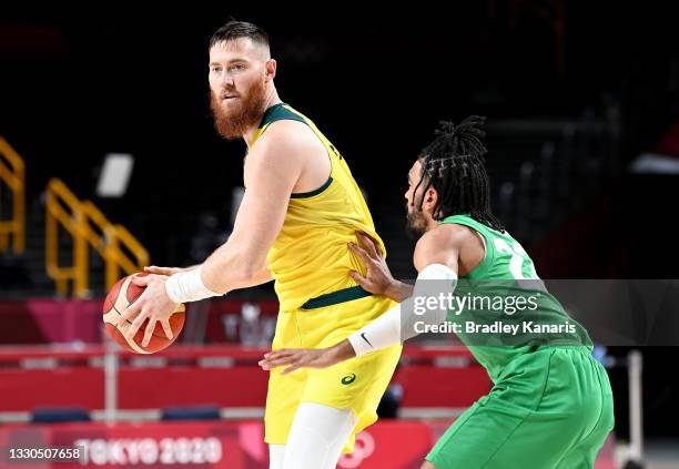 Aron Baynes of Australia looks to pass during the preliminary rounds of the Men's Basketball match between Australia and Nigeria on day two of the...