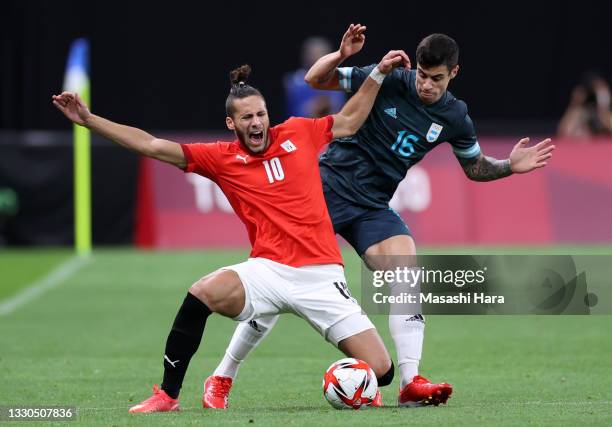 Ramadan Sobhi of Team Egypt is challenged by Martin Payero of Team Argentina during the Men's First Round Group C match between Egypt and Argentina...