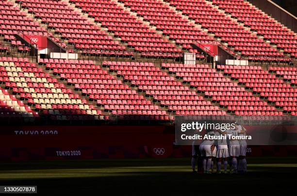 Players of Team New Zealand form a huddle in front of empty seats prior to the Men's First Round Group B match between New Zealand and Honduras on...