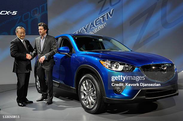 Actor Patrick Dempsey and Takashi Yamanouchi, President and CEO of Mazda Motor Corporation, pose next to the newly unveiled Mazda CX-5 at the LA Auto...