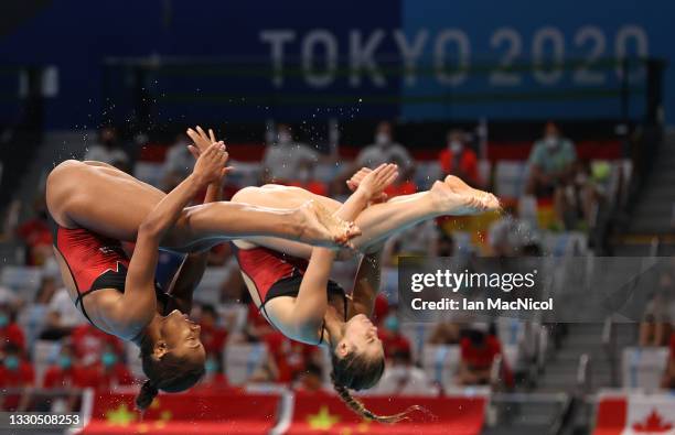 Jennifer Abel and Melissa Citrini Beaulieu of Canada compete in the Women's Synchronised 3m Springboard on day two of the Tokyo 2020 Olympic Games at...