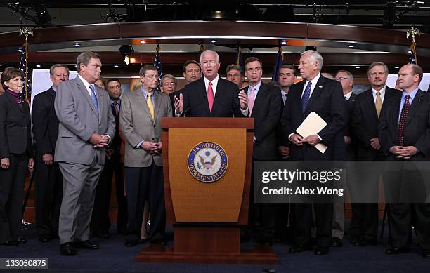 Sen. Saxby Chambliss speaks as other congressioal members including Rep. Mike Simpson , Sen. Kent Conrad , Sen. Mark Warner , and House Minority Whip...