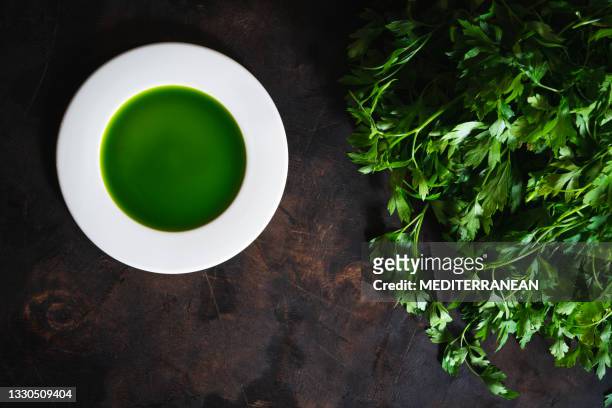 parley sauce green in a plate on with fresh parsley leaves over dark - curly parsley stock pictures, royalty-free photos & images