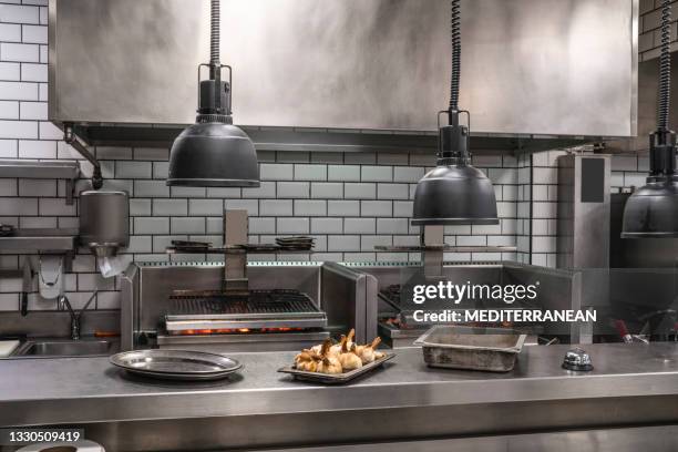 professional restaurant stainless steel kitchen with coal embers grill - commercial kitchen stock pictures, royalty-free photos & images